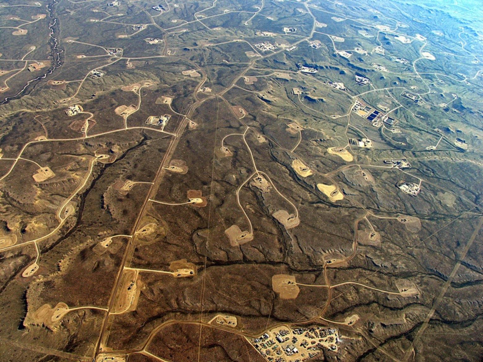 Natural gas drilling pads pepper the Jonah Field and Pinedale Anticline in the southern tier of the Greater Yellowstone Ecosystem, causing severe impacts to migratory wildlife and their ancient corridors. Former Gov. Dave Freudenthal, after once inspecting the Jonah Field and lamenting the destruction of wildlife habitat, called it "an example of what not to do."  Photo courtesy Ecoflight (ecoflight.org)