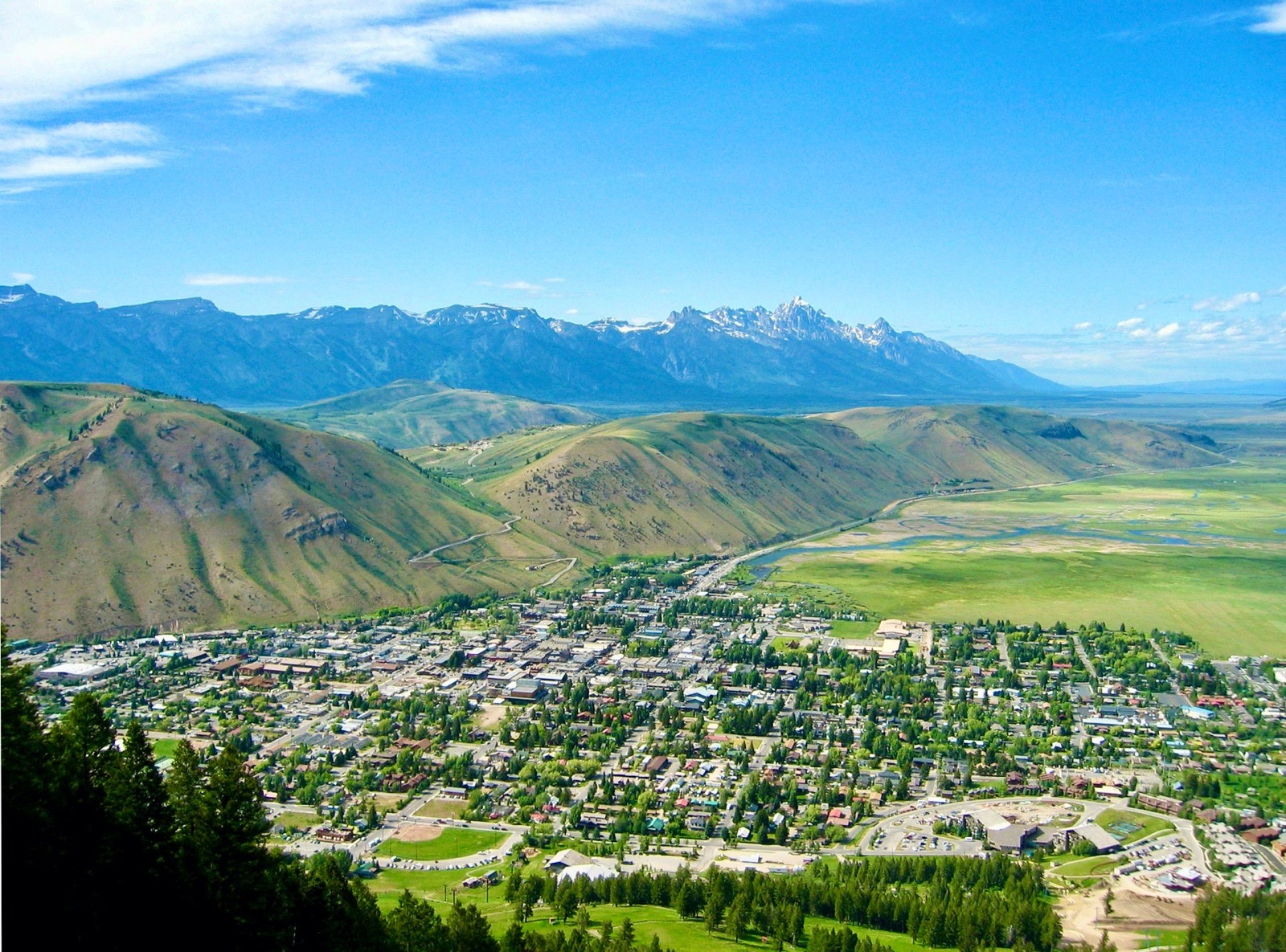 A view of the town of Jackson, Wyoming looking northward from the top of Snow King toward the Tetons and Grand Teton National Park in the distance. Photo courtesy Wikipedia. 