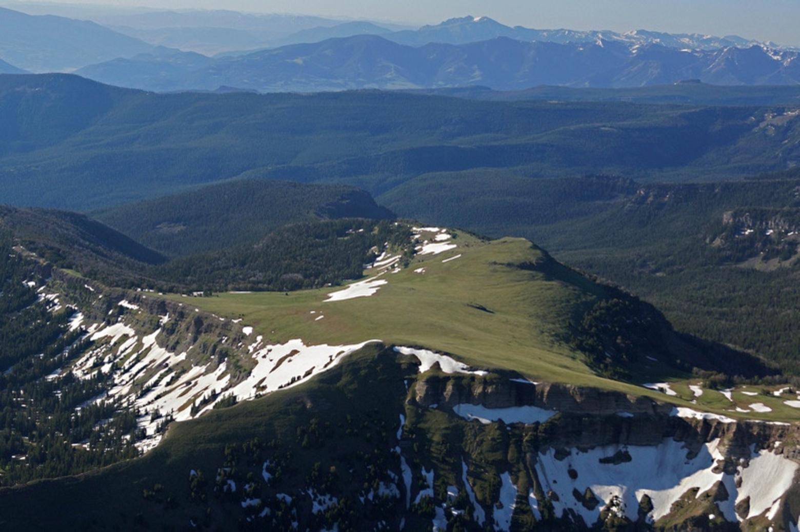 The Gallatins are the only mountains rimming Yellowstone not permanently protected with federal Wilderness.  Pictured here is the wild crest of the Gallatins and the wildlife-rich drainages falling away on the west toward the Gallatin River and on the east spilling into Paradise Valley and the Yellowstone River. Photo courtesy Ecoflight