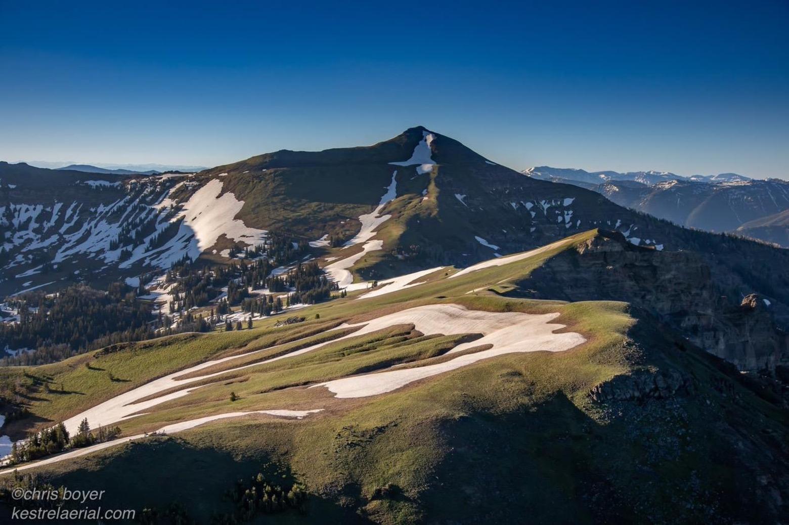 The rugged and unmarred ridge of the Gallatin Range that rises east of Big Sky.  It's topography like this that prompted Wyoming Congressman Teno Roncalio to refer to Greater Yellowstone as "the Alaska of the Lower 48 states." Photo by Chris Boyer (kestrelaerial.com)