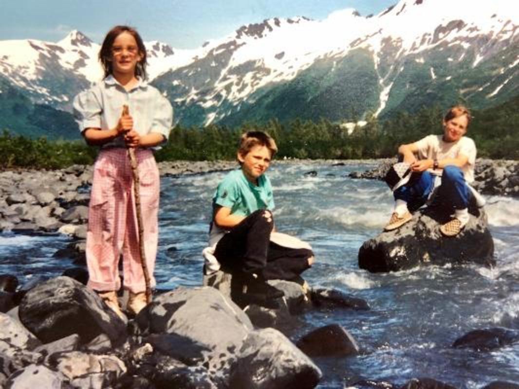 Emilie Saunders and her siblings getting their feet wet early on in Alaska.