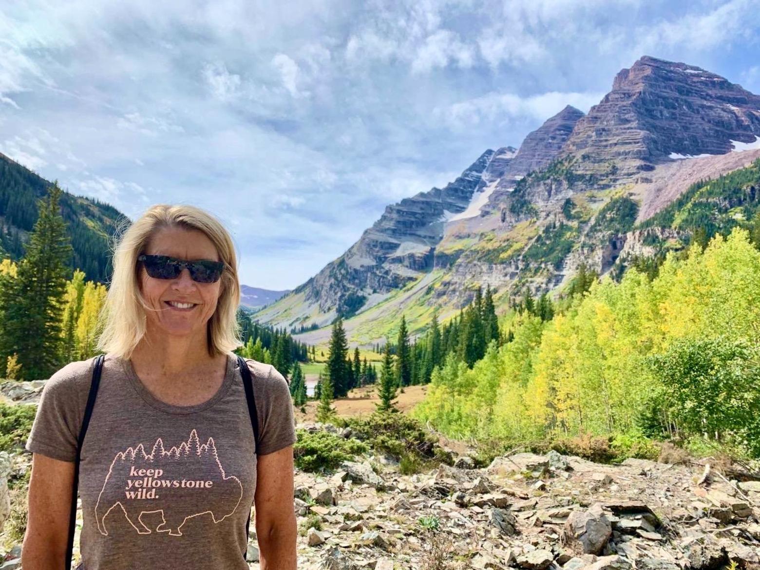 Lisa Diekmann wearing one of her Mountain Journal tees in Yellowstone.