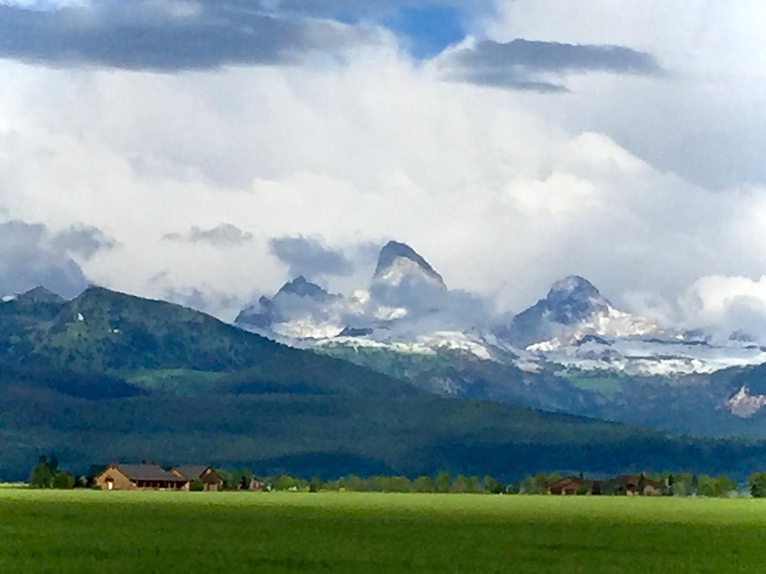 The western slopes of the Tetons as viewed from Teton County, Idaho which is coping with an inundation of newcomers and people who work across the mountains in Jackson Hole but cannot afford to live there. Photo by Todd Wilkinson