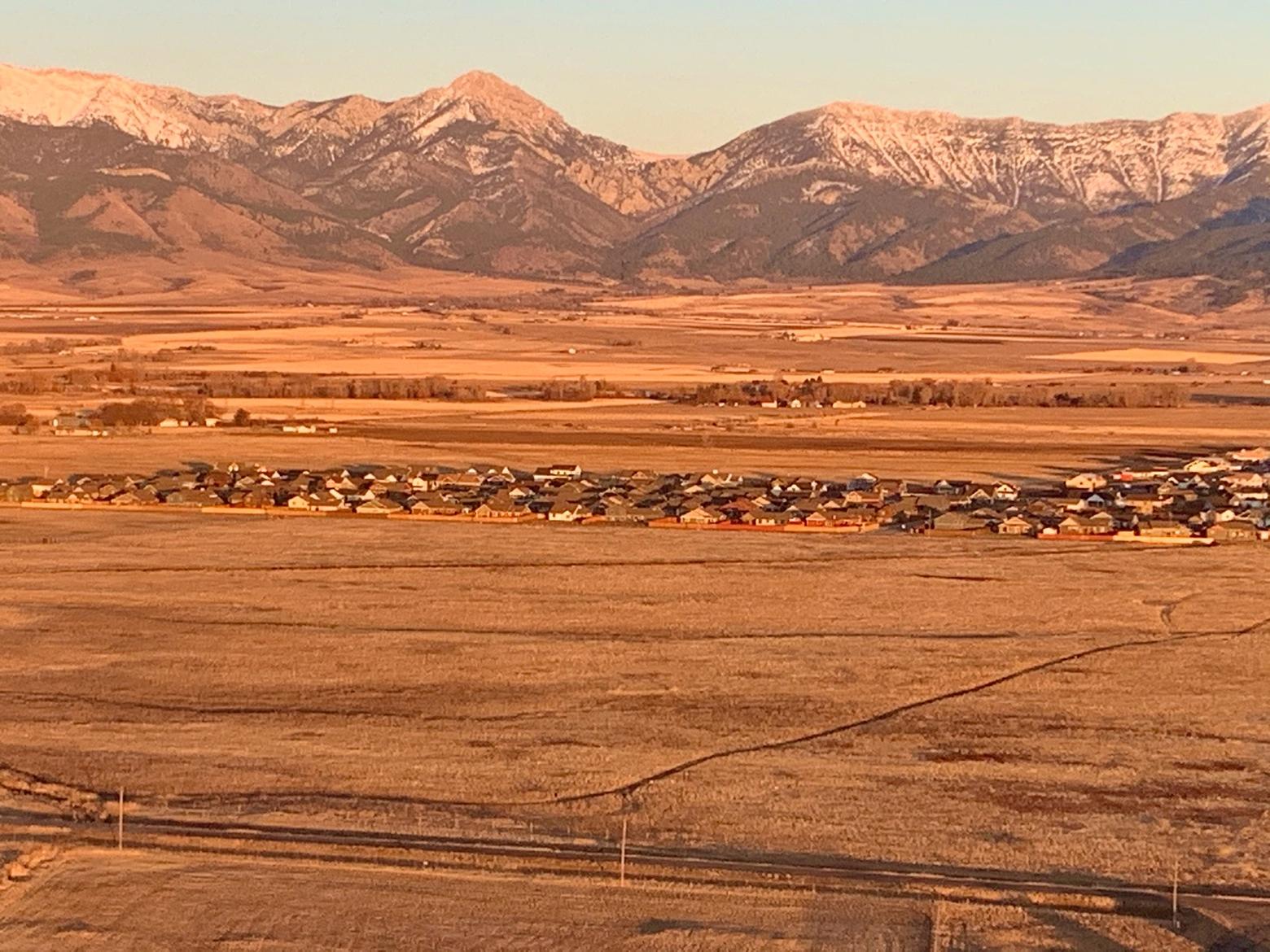 Landscape ecologists say pictures can be deceiving. What may appear pastoral today can, with rapid infill of development, transform ag and undeveloped open lands into suburbs where wildlife disappears. Huge swaths of the Gallatin Valley and many valleys in Greater Yellowstone have already been subdivided. The only question is if and when homes might appear. Then it becomes extremely expensive to protect what remains, despite heroic efforts by groups like local land trusts.  Photo by Todd Wilkinson