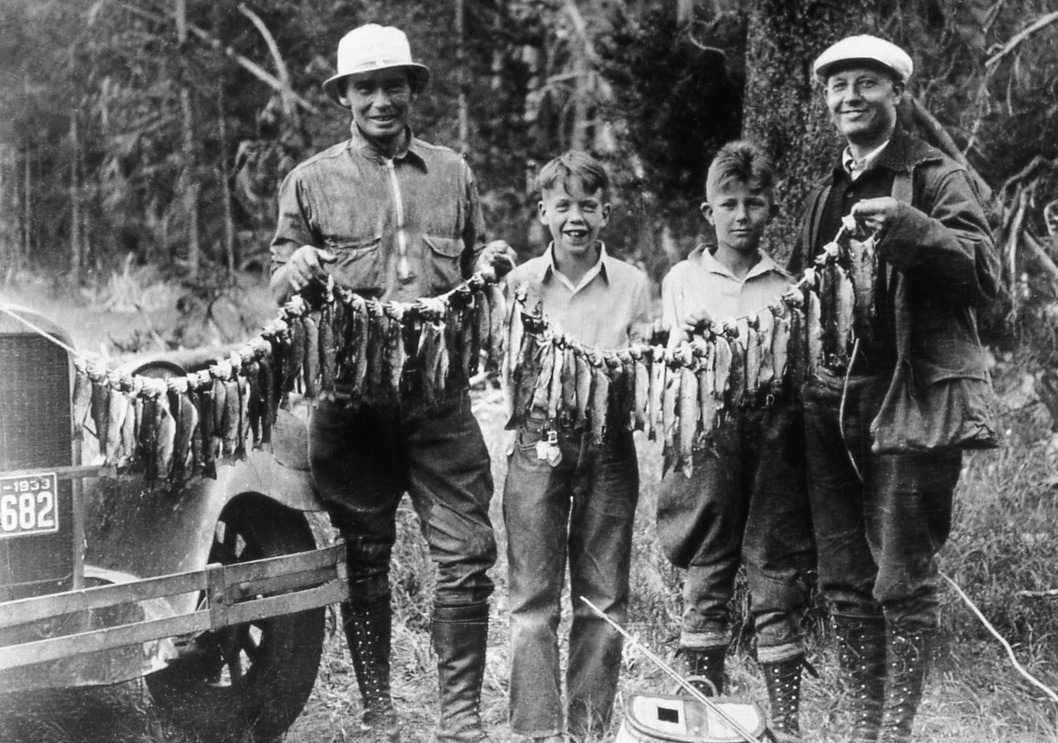 Decades before catch and release fishing regulations arrived in Yellowstone, anglers caught and kept as many trout as they liked.  This photo was taken in 1933 and represents the attitude of excess that was common in the era and reflective of park visitors who had a poor understanding of how nature has limits to human impacts. Photographer unknown/courtesy NPS