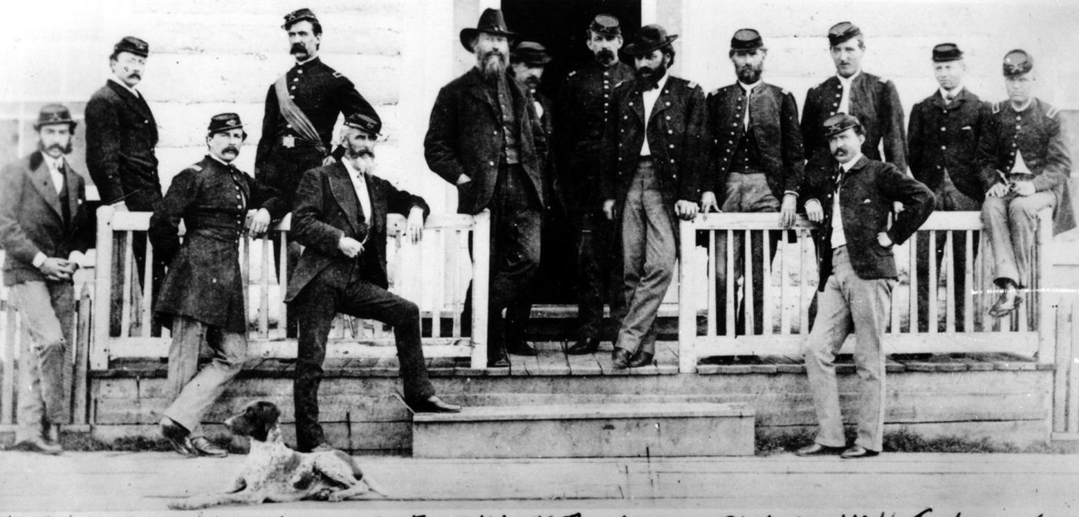 Gustavus Doane, 2nd Lieutenant in the Second Cavalry, fourth in from left (standing) at Fort Ellis outside Bozeman in 1870. Earlier that same year, in January, Doane was an officer who was instrumental in carrying out the Marias Massacre that killed more than 200 Piegan Blackfeet. Photo taken by William Henry Jackson, the photographer who accompanied painter Thomas Moran to Yellowstone and whose imagery, together, helped persuade Congress to create Yellowstone as the world's first national park.