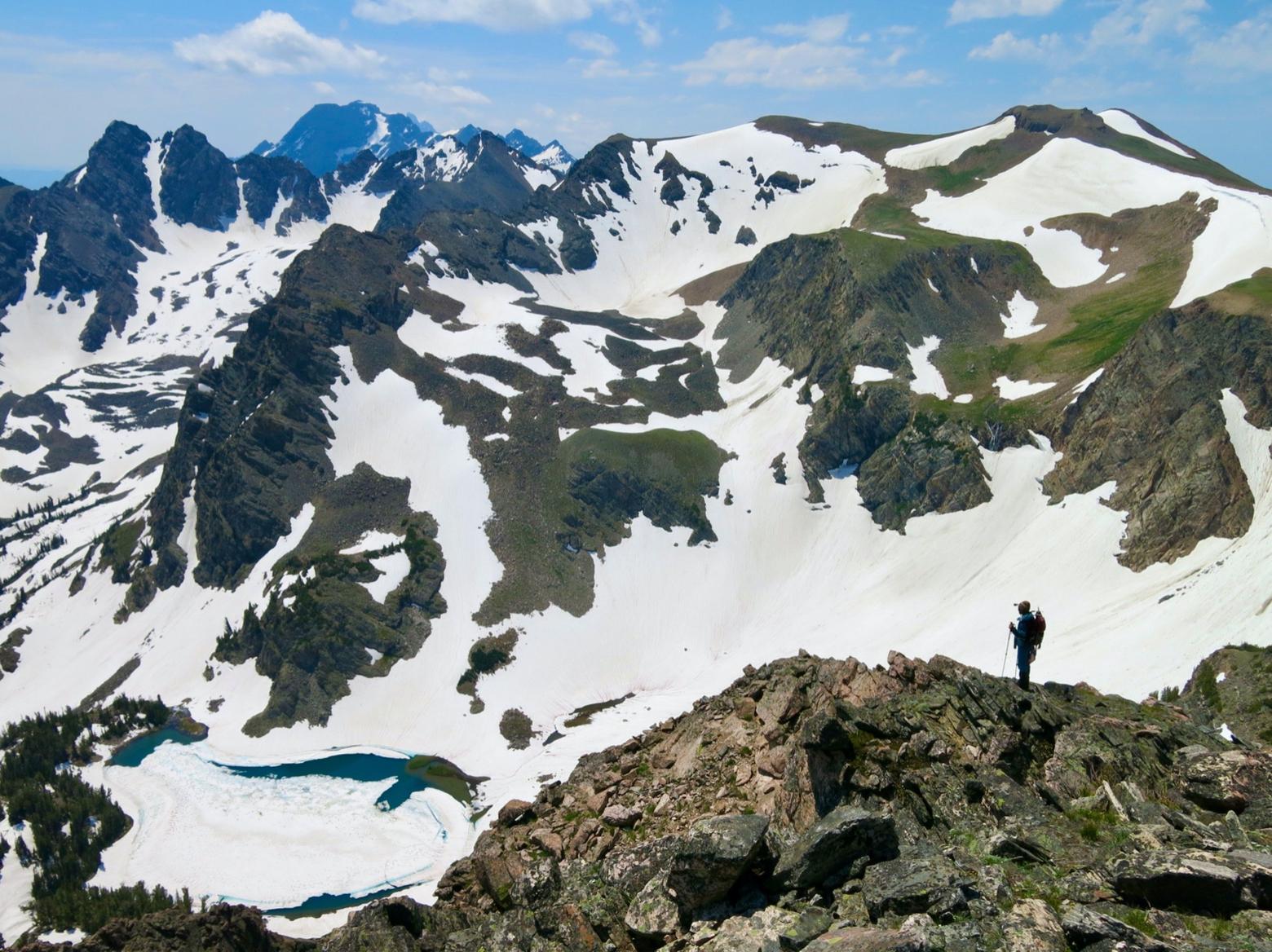 Jen Burrit on the summit of Ranger Peak in Grand Teton National Park. On the skyline above head stands Peak 11,360, also known as Mount Doane. Photo courtesy Todd Burritt