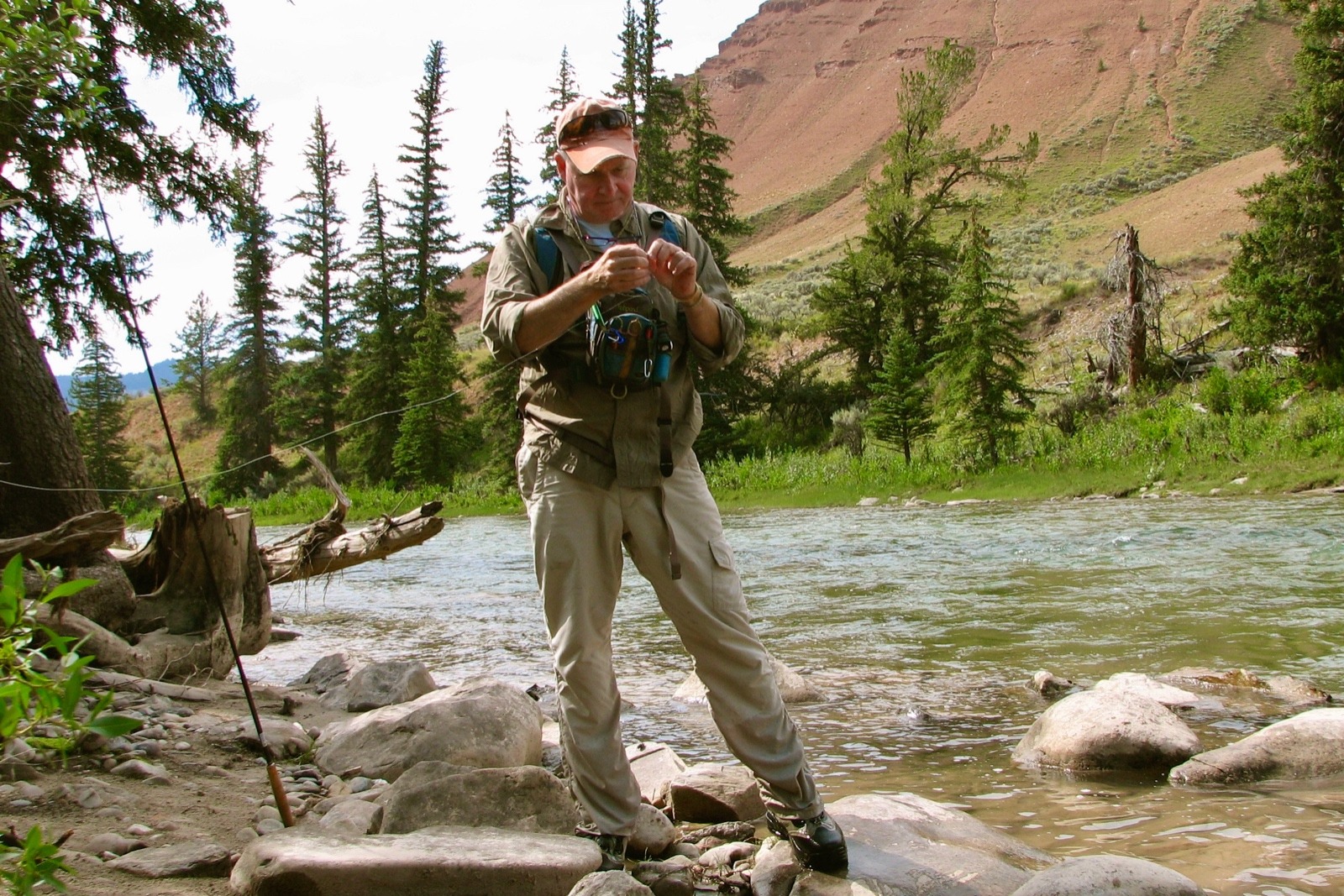 Tom Sadler putting a fly on the tippet of his Tenkara rod in the West. "If you want to understand the ecology, politics and cultures of the West," he says, "then the best place to start is understanding how water arrives and moves across the landscape. And the same is true with public policy and Washington DC."  Photo courtesy Tom Sadler