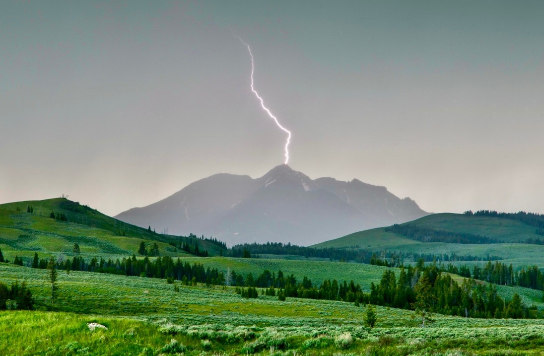 Lightning strikes Electric Peak during a thunderstorm passing over Yellowstone National Park. Photo by Neal Herbert/NPS