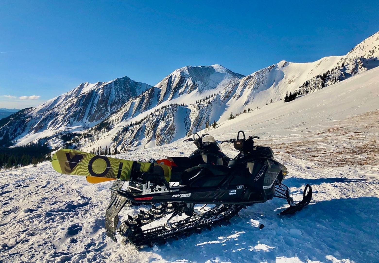 In the mountains of the Custer Gallatin National Forest, two snowmobiles illustrate how more snowboarders and skiers than ever before are being hauled to the high slopes. Not only are they venturing deeper into the backcountry than ever before but scientists say more human activity can stress wildlife that have limited body fat in winter, disrupt solace and trigger avalanches. Photo courtesy USDA Forest Service