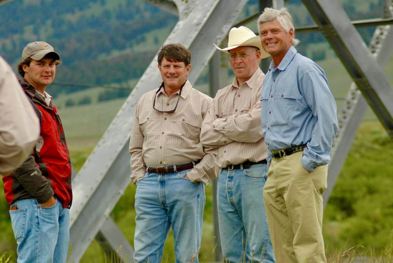 A gathering at Tom Sadler's wedding party in the Madison Valley of Montana at Three Dollar Bridge. Left to right: son of the bride Matt Henderson, best man the late Jim Range,  Sadler and angler-conservationist Craig Mathews who officiated the ceremony. Along with the late Alex Diekmann of Trust for Public Land, they also were major players involved with the Three Dollar Bridge fishing access and riparian corridor protection project.  Photo courtesy Tom Sadler