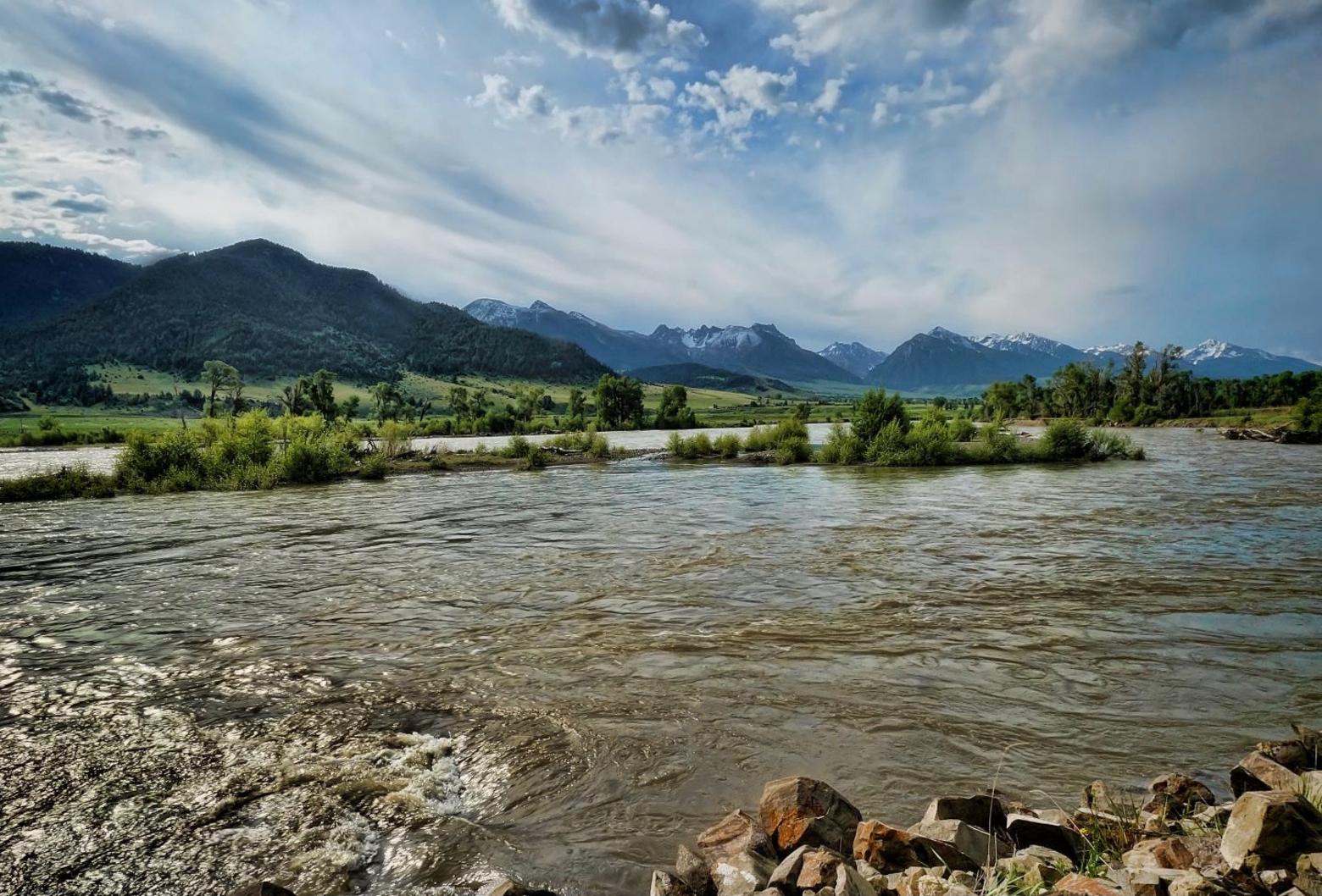 The Yellowstone as it flows through Paradise Valley with the Absarokas rising behind. Generations of advocates have rallied in defense of the iconic Yellowstone to prevent it from being tamed by dam-builders, unscrupulous land developers, and others. But Covid times have accelerated real estate sales and the desire by some to impose their will on this watery gem and globally-famous trout river. The Yellowstone is the longest-flowing undammed river in the Lower 48 and it originates in the mountains above Yellowstone Park in the Bridger-Teton National Forest of Wyoming. Today in Livingston, Montana, proponents of a new community recreation center want to build the facility not far from the river's edge. River corridors are among the most important for wildlife and the scenic views are embedded in the character of  Livingston and Paradise Valley themselves. Photo courtesy Mary Harrsch/Flickr/CC 2.0