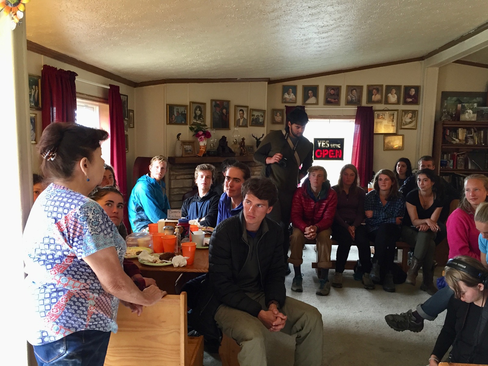 Students from Whitman College, partaking in the college's lauded "Semester in the West" program that puts them on the road for 100 days, listen to Lakota restauranteur Betty O'Rourke on the Pine Ridge Reservation in South Dakota.  Todd Wilkinson photo