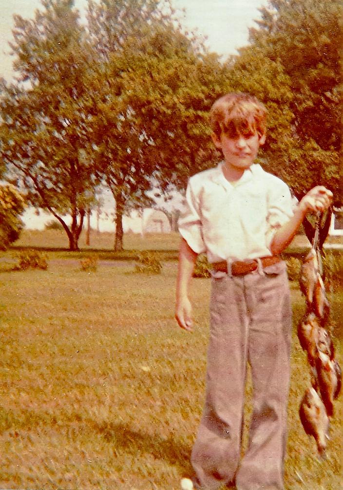 Orsted, the seemingly happy-go-lucky boy with a string of bluegills, unaware of what awaited him in the years ahead.