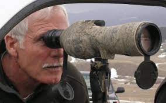The moment Ted Turner stepped forward and peered through a spotting scope to see the place where the first wolves, dispersing from Yellowstone, had been feeding on a winter-weakened elk. Phillips had phoned Turner and informed him that wolves were back on the ranch, fulfilling the media mogul's desire to have his property be a home for every wildlife species that originally inhabited that southwest corner of the Gallatin Valley.  After Turner received Phillips' call, he headed for Montana immediately to bear witness.  Today, the Flying D is home to one of the largest wolf packs in America and its presence has not had a major negative impact on Turner's private bison or with public elk that live on the ranch and pass through it. Photo by Todd Wilkinson