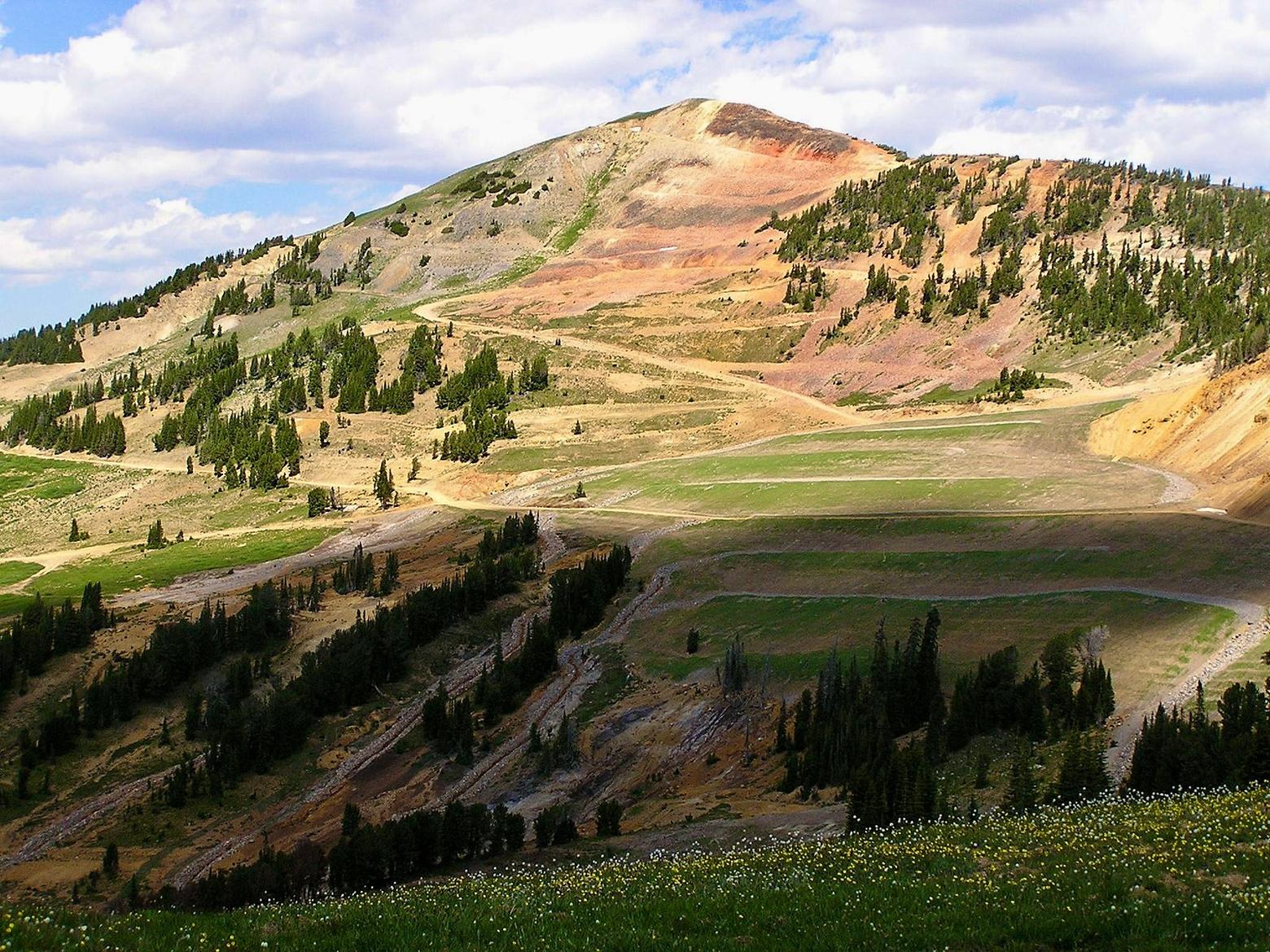 Henderson Mountain already bore the scars and legacy of historic, abandoned hardrock mining. Had the New World Mine moved forward, this area, which today is home to grizzlies, moose, wolverines, elk, bighorn sheep and has streams feeding some of Greater Yellowstone's fisheries, would have been turned into an industrial zone with a massive tailings pit of toxic detritus. Instead, it's been cleaned up as a result of the mining fight. Photo courtesy US Forest Service