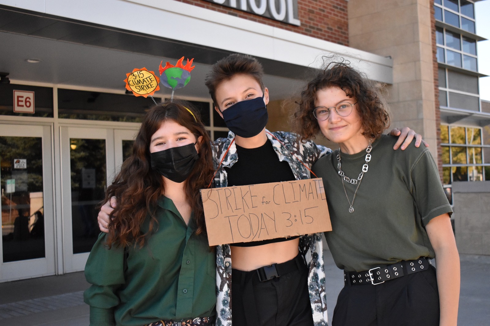 Climate activist Lily Morse is flanked by Ellie Cornish on the left and Cady Diamond on the right. Photo courtesy Lily Smith of Hawk Talk