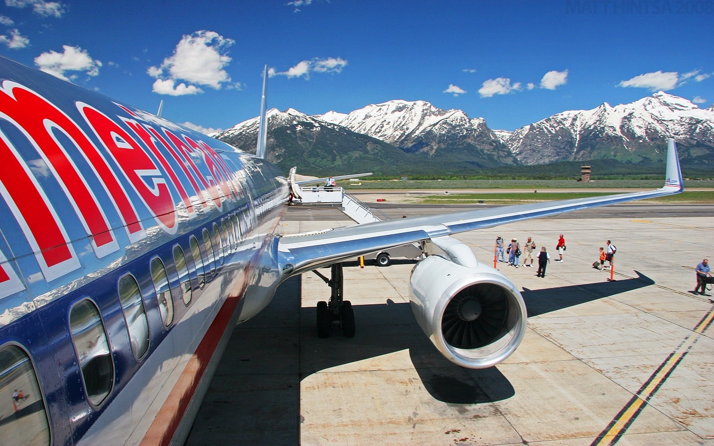 Passengers get off a jet at Jackson Hole Airport. Photo courtesy Matt Hinta (CC by-NC-NC 2.0)