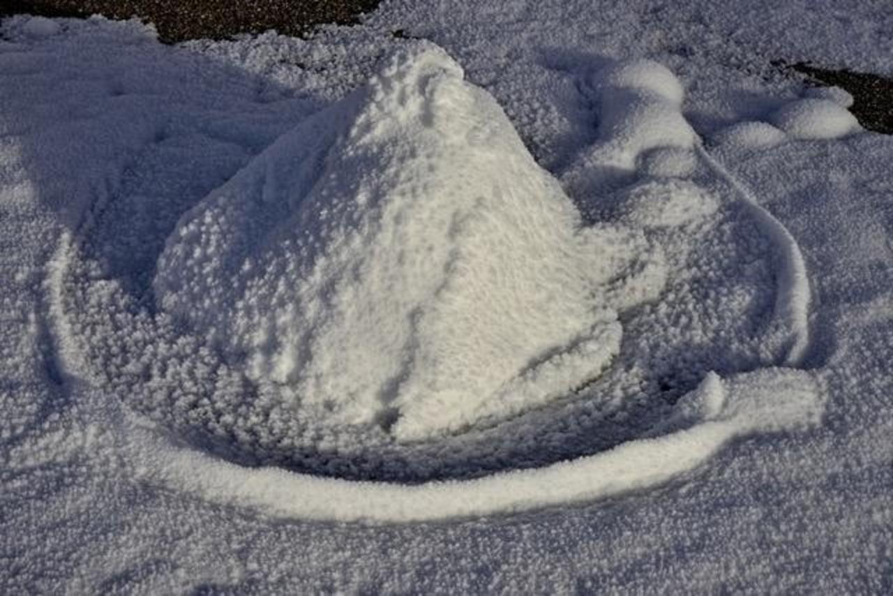 Aeolus—The Wind Sculptor of snow and sands creates a curious wall 'round an extinct mud cone.