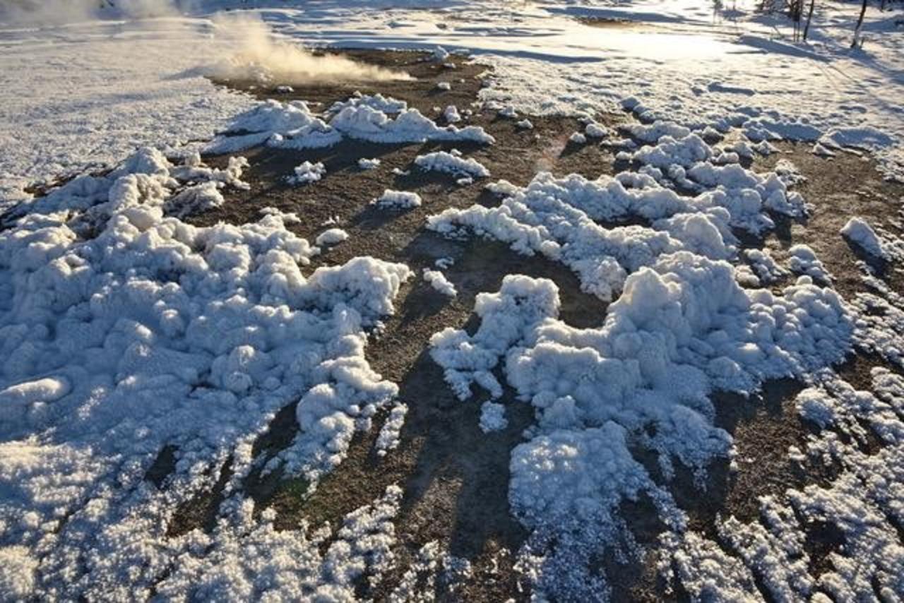 Here columnar frost on the floor of a geyser basis is topped by clumps of frost and snow.