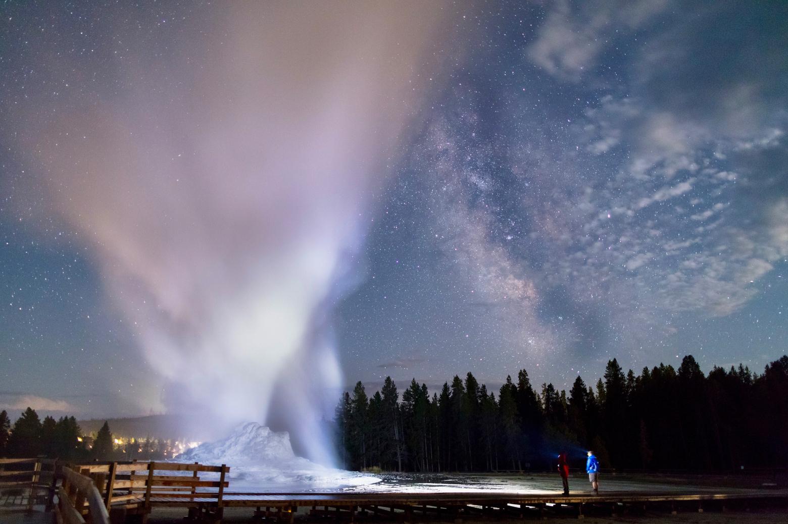 A father and son share a nighttime eruption of Castle Geyser in Yellowstone. Photo courtesy Jacob W. Frank/NPS