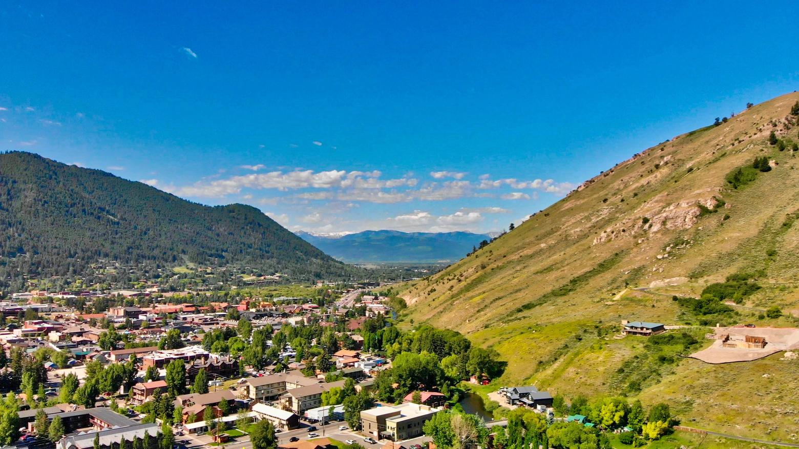 As development intensifies on private land in Jackson Hole, it is negatively affecting wildlife and habitat on adjacent federal public land, as with the Bridger-Teton National Forest represented by forested mountainous areas on the left-hand side of this photo. It also is created islands of of habitat as represented by East Gros Ventre Butte to the right. Meanwhile, as private land development surges in the region, one entity that has been strangely silent in raising concern about impacts on public land is the Greater Yellowstone Coordinating Committee, comprised of the major federal land management agencies. GYCC was formed 60 years ago to promote thinking across invisible administrative boundaries. Critics say that not only does the GYCC lack teeth but its leadership doesn't possess the courage to make the public aware of how development is impairing public lands.  Photo license from Shutterstock/GagliardiPhotography