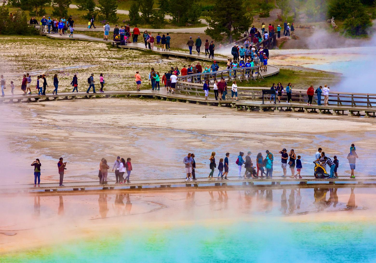 Somewhere over the rainbow: visitors grace the boardwalk leading to Grand Prismatic, the largest colorful hot spring in America on a not very crowded day in Yellowstone. Photo by Jacob W. Frank/NPS 