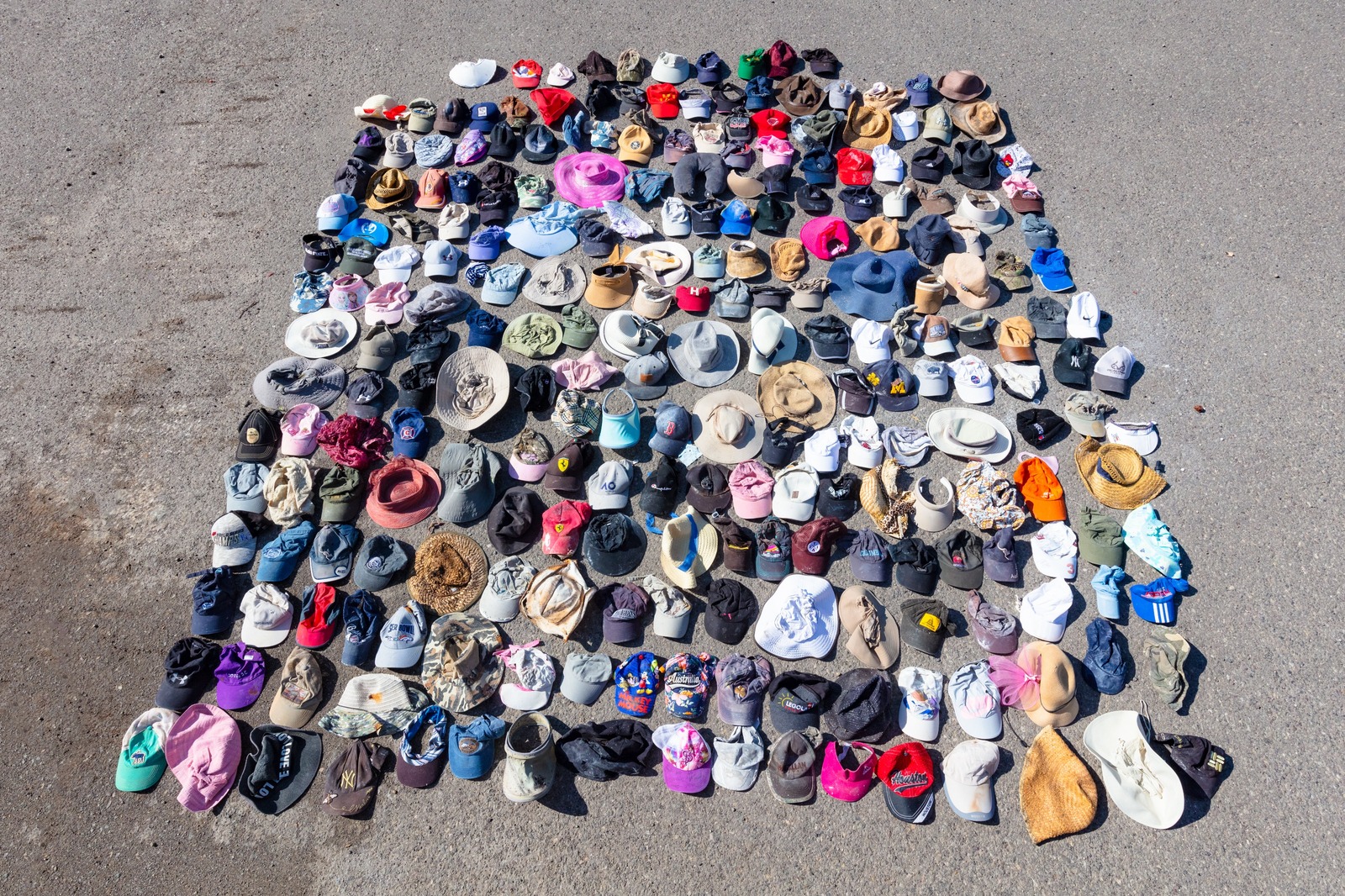 Quirky datapoint: a small sampling of the number of visitor hats that blew off heads into Yellowstone' geothermal areas in 2018. When Covid arrived two years later, and visitation soared to unprecedented levels, there was no hat count but resource violation by visitors in fragile areas around geysers and hot springs skyrocketed and rangers complained how difficult it was to manage the masses. Photo courtesy Jacob W. Frank/NPS