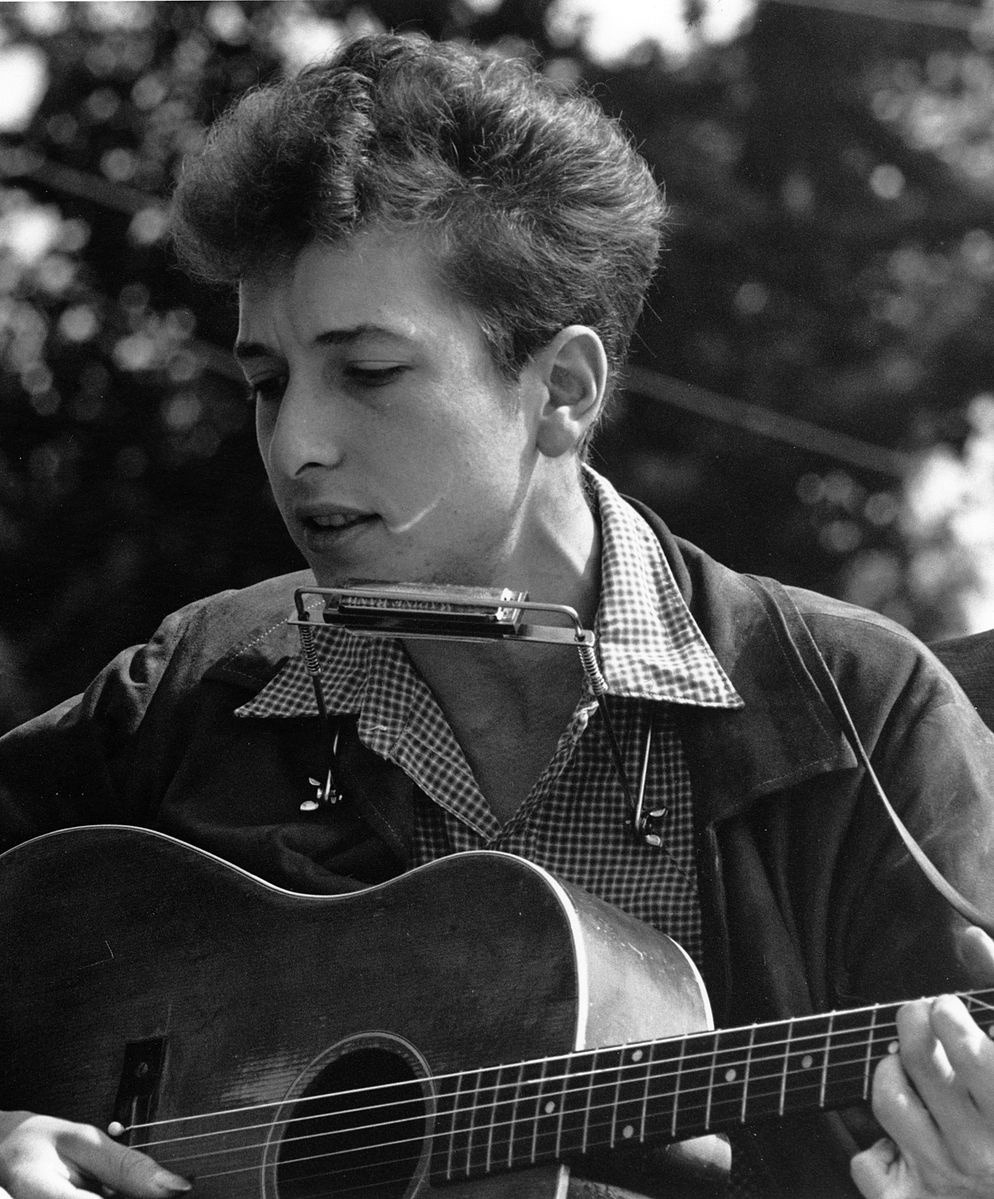 Young Bob Dylan on the verge of becoming a meteoric phenomenon. Next to Joan Baez along the National Mall in Washington DC, he performed at the historic Civil Rights March on August 28, 1963. Photo courtesy National Archives /Records of the US Information Agency