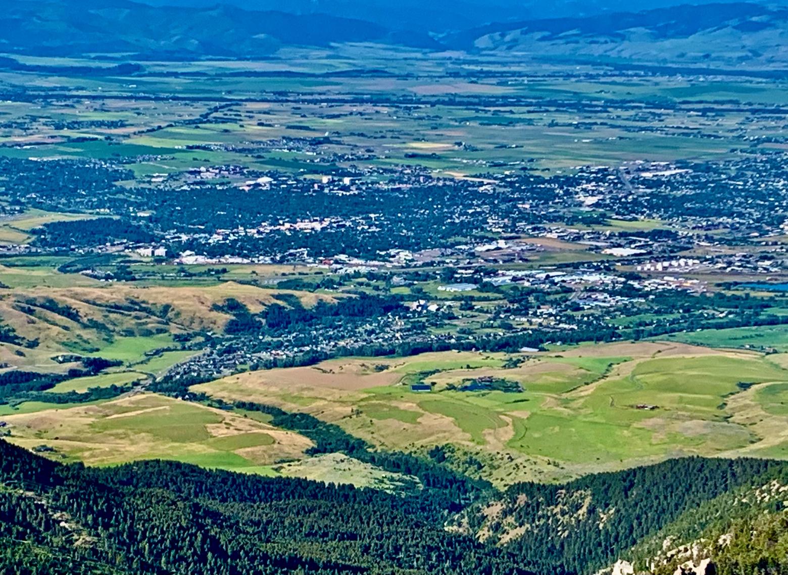 View from the Bridgers looking back toward the northeast edge of Bozeman. Out of view, lower left, is the popular "M" hiking trail. With all due respect offered to the Forest Service and Center for Large Landscape Conservation, how do they imagine the foreground possibly being a viable wildlife migration corridor as the land continues to fill in? Photo by Todd Wilkinson
