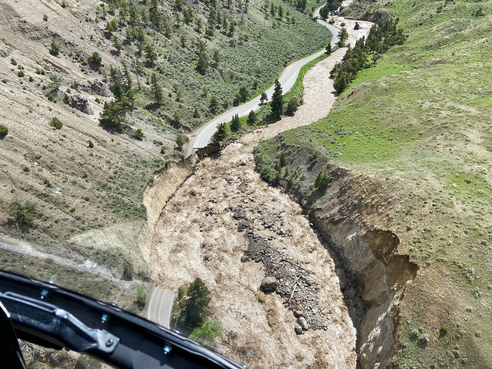 The historic north road leading from Gardiner, Montana to Yellowstone's headquarters at Mammoth Hot Springs was devastated by Monday's floods and may be irreparable. The destruction means that the rest of the 2022 tourist season in the entire northern half of the park is likely done.  Photo courtesy NPS