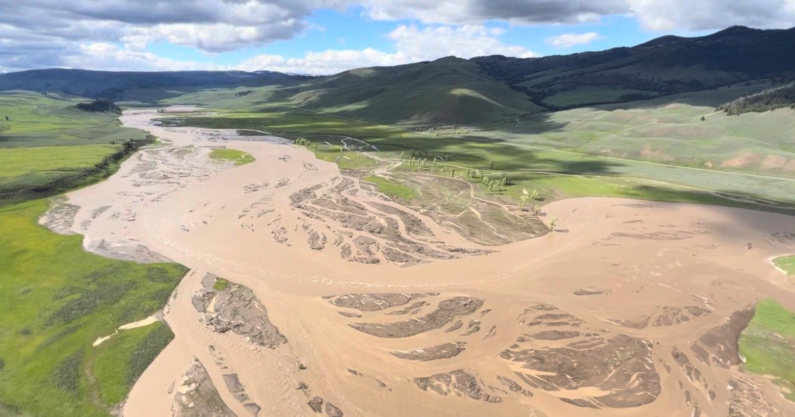 The Lamar Valley is a major destination for wildlife watchers going to Yellowstone.  Here in this photo by Jacob W. Frank/NPS, one can see how the Lamar River flowed out of its banks. Floodwaters have receded.  Park officials say some tourism will be restored to the North Loop but for now only in the company of an authorized guide. 