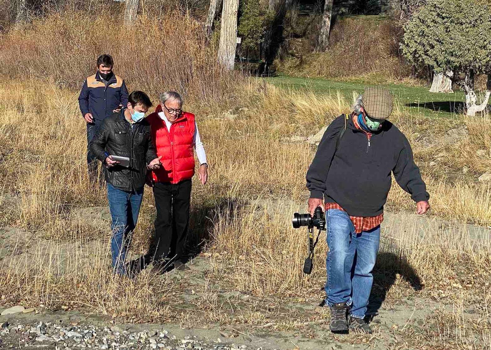 O'Connor on assignment writing a magazine profile on network newsman, award-winning writer, conservationist and part-time Montana resident Tom Brokaw. Behind O'Connor: Eric Ladd, head of Outlaw Partners. Ahead of them: photographer Thomas M. Mangelsen.  Photo courtesy Sue Cedarholm.