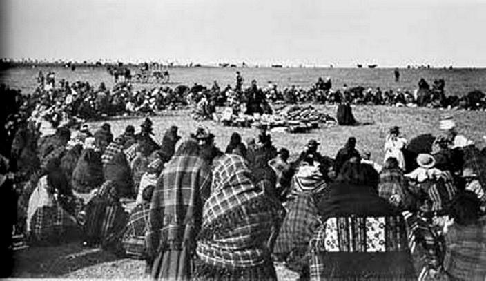 Lakota gather at a giveaway in which those with more material forturne share with those who have lesss and are in need.  