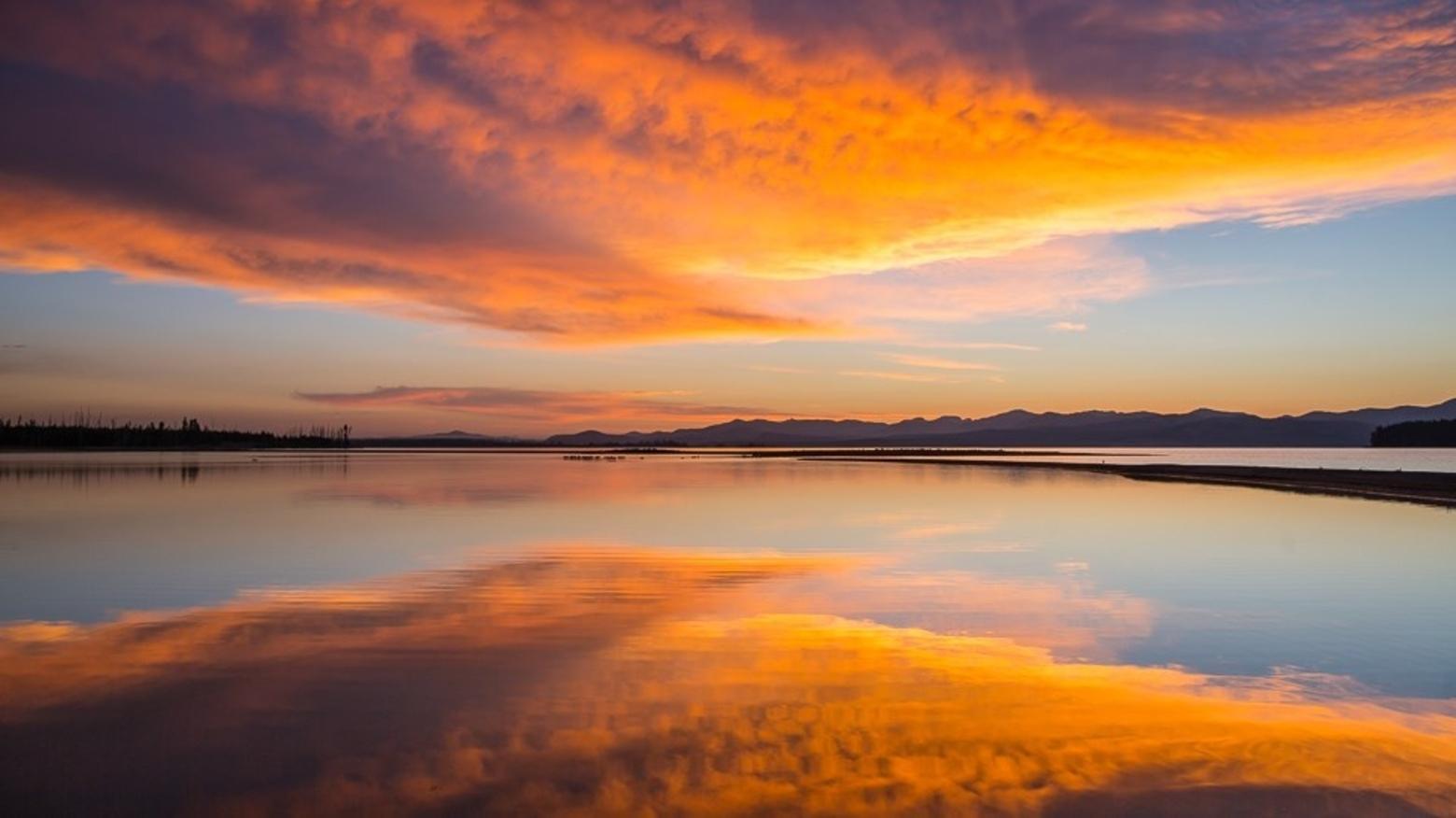 By tracking the level of Yellowstone Lake over time, it's possible to understand more about a range of subjects, from the hydrology of stream flow to the physical properties of the magma reservoir beneath the Yellowstone Caldera. Photo by Neal Herbert/NPS