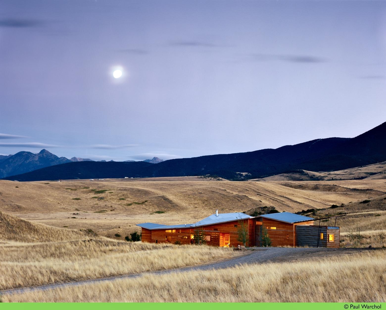 Located on a 45-acre parcel of natural land, this house sits between the folds of rising hills hidden from view and was the author's first home design.  Fencing was removed to allow for elk migration and other wildlife to roam freely and safely. Photo courtesy Paul Warchol (warcholphotography.com)