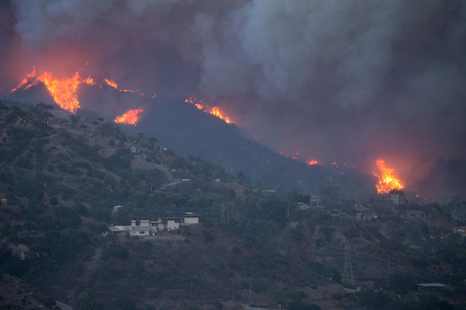 The wildland-urban interface is the fastest growing land-use type in the country. With further growth comes further risk of wildfire. Here, the Thomas Fire approaches Montecito in Southern California.  Photo by Kari Greer