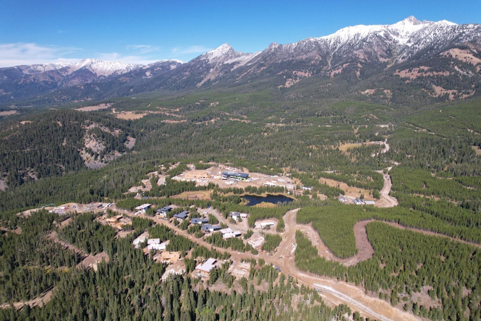 The luxury resort One and Only in Moonlight Basin is under construction as the company's first resort in North America. Beyond, Jack Creek Road, the private unpaved route between Big Sky and Ennis, stretches horizontally across the photo, and is a would-be evacuation route west from Big Sky. While a complete simultaneous evacuation of Big Sky is unlikely, in the event of a wildfire many say it would present major egress challenges for emergency managers. Photo by Chris Kamman