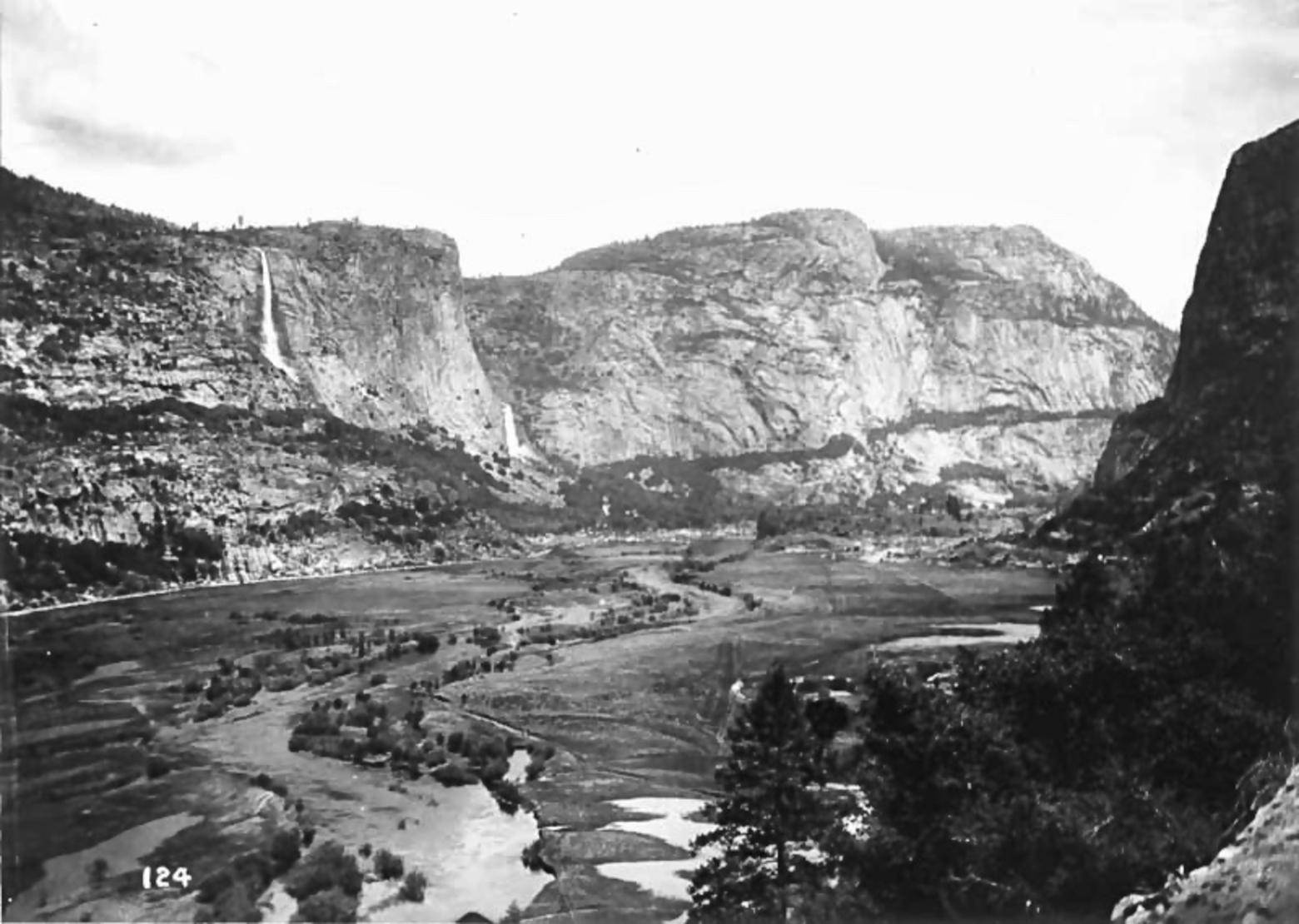 Waterfalls draping the mountains and the Tuolumne River flowing tranquilly through its middle, this is what the Hetch Hetchy Valley in Yosemite National Park looked like early in the 20th century. Photo courtesy National Park Service