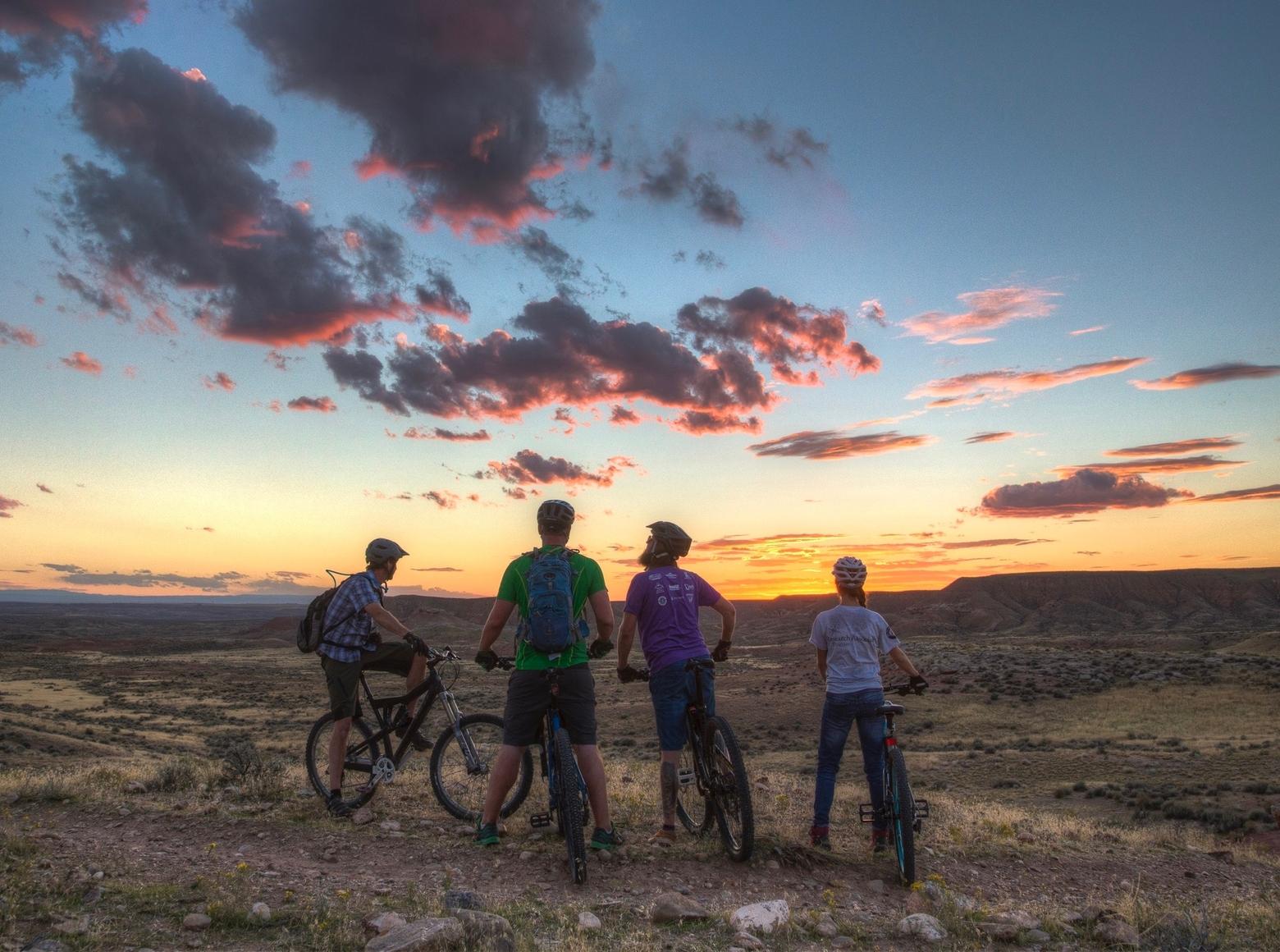 Mountain bikers savor a sunset in the Utah desert near Vernal. Studies show that outdoor recreationists are passionate about opening new pathways into wild country and, at the same time, many user groups that claim to value wildlife conservation do not want their access limited in order to protect wildlife habitat. Another study, mentioned below, shows that college-aged outdoor recreationists are resistant to paying a tax on outdoor gear that would generate funds for conservation. Therein lies a disconnect. Photo courtesy Bob Wick/BLM  
