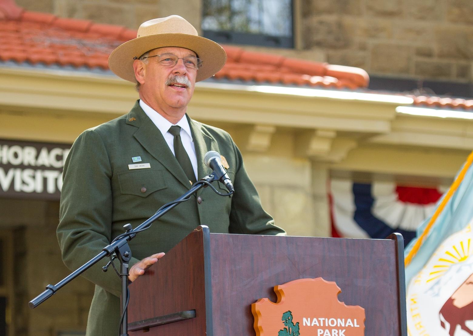 Dan Wenk, who served as superintendent of Yellowstone National Park from 2011-2018, addresses a crowd at the Albright Visitor Center in 2015. "Managing Yellowstone National Park was the greatest honor and privilege of my life," he says. Photo by Neal Herbert/NPS