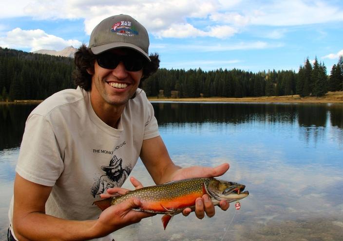 Author Ben Goldfarb with a nonnative brook trout he caught in the northwest corner of Yellowstone National Park, circa 2014. An invasive species, brook trout threaten the native Yellowstone cutthroat. Photo courtesy Ben Goldfarb