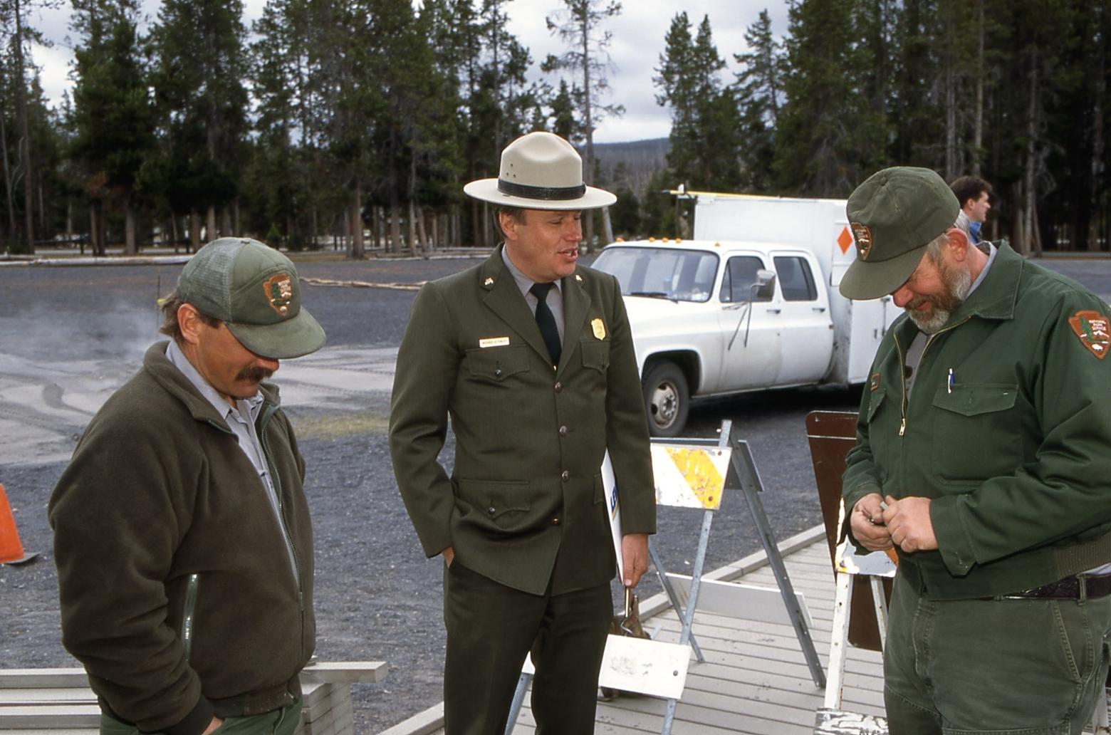 Paul Anderson, Mike Finley and Al Bowers on the new Unilever boardwalk at Old Faithful in Yellowstone, October 1996. Photo by Jim Peaco/NPS
