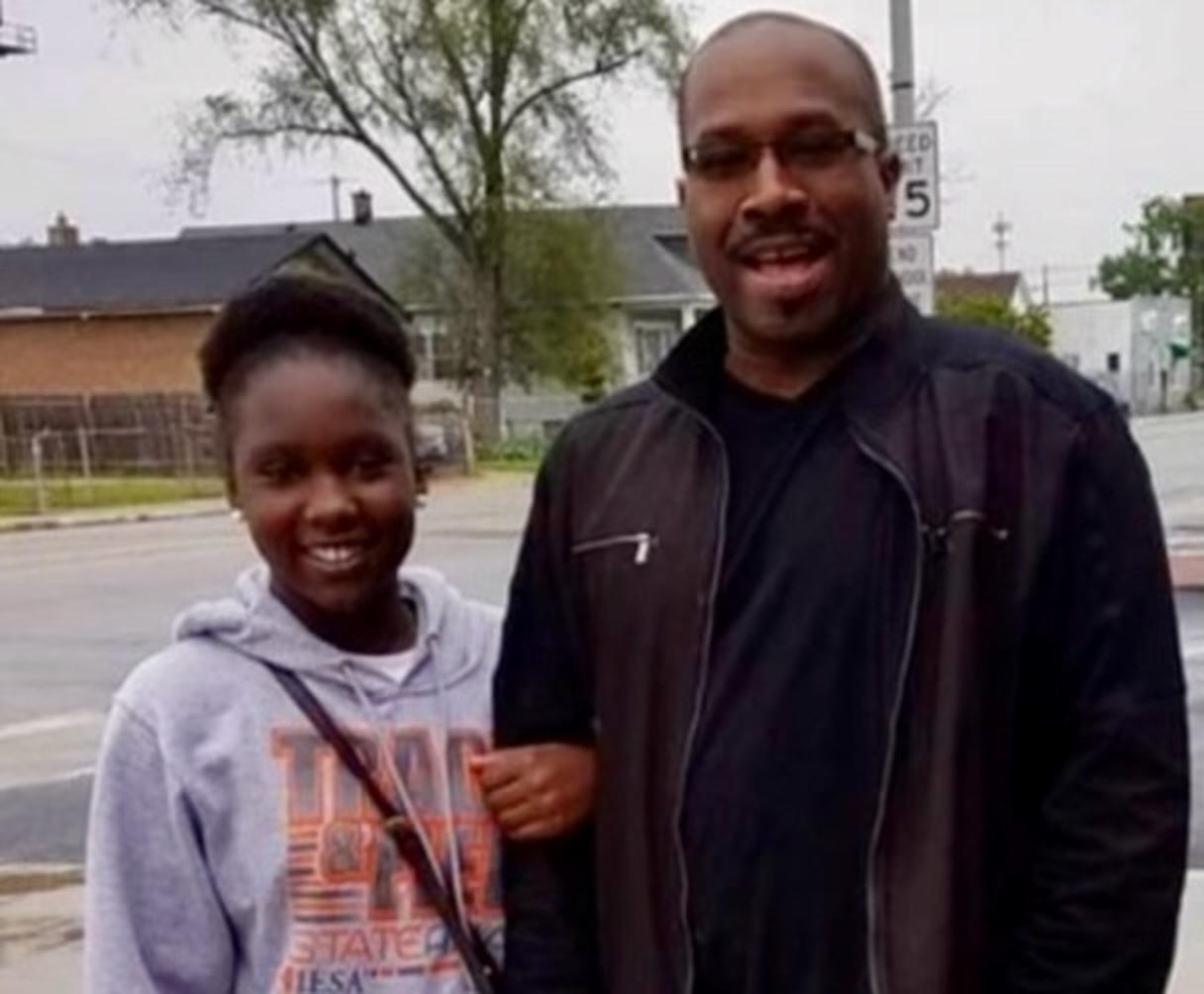 A 12-year-old Paris Harris stands with Calumet Park Fire Chief Howard Fisher when Harris attended the fire academy. Photo courtesy Howard Fisher