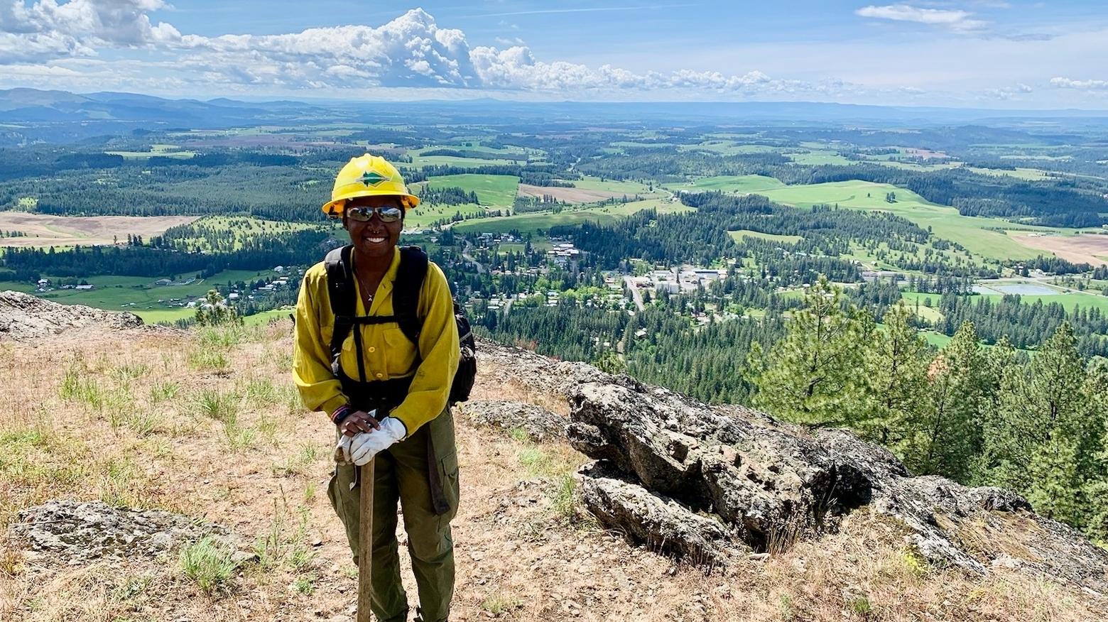 Paris Harris stands atop Potato Hill, colloquially called Spud Hill, north of Deary, Idaho after her first hike. Photo courtesy LaVell Rucker