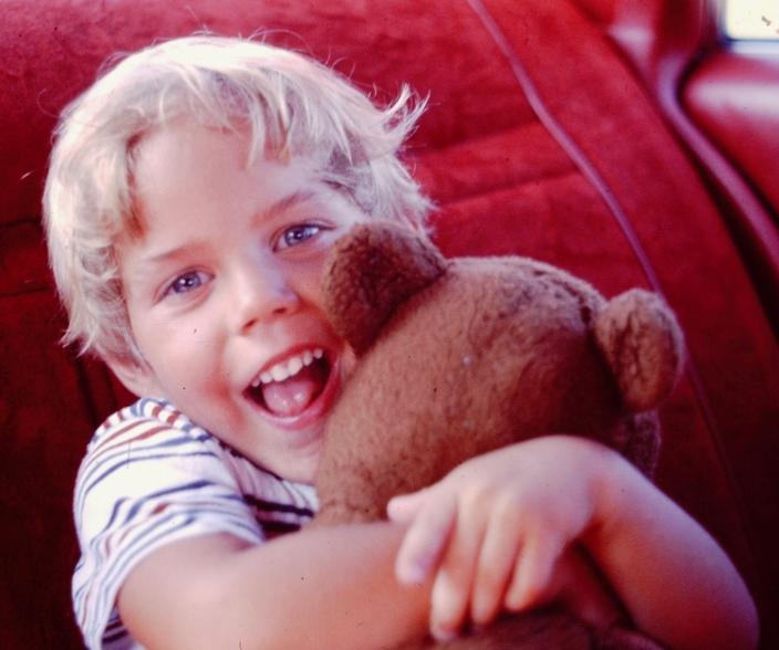 "My parents had me camping in a portable crib when I was six weeks old and family camping trips are my happiest memories," Kevin Grange says. "I had a teddy bear and my love of bears just grew from there." Here, the author at 3 gives his bear a squeeze. Photo by Barb Grange