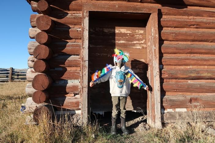 "A parrot it is." Oren shows off his parrot costume at the Harriman Sheep Barn.