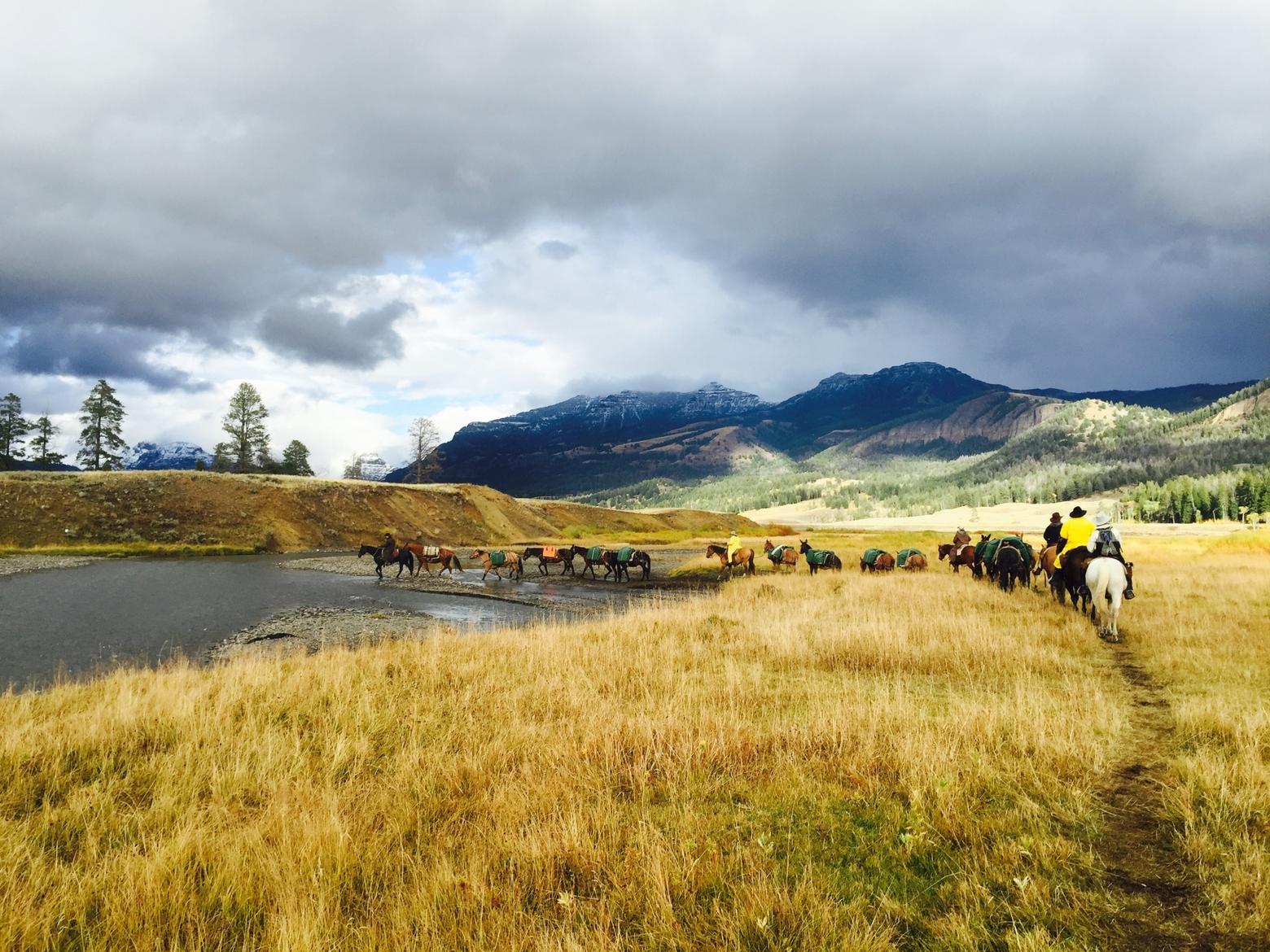 Certain SNOTEL sites must be accessed on horseback, including Wilderness areas and national parks. Here, NRCS staff ride into the Parker Peak SNOTEL in Yellowstone. Photo courtesy Eric Larson