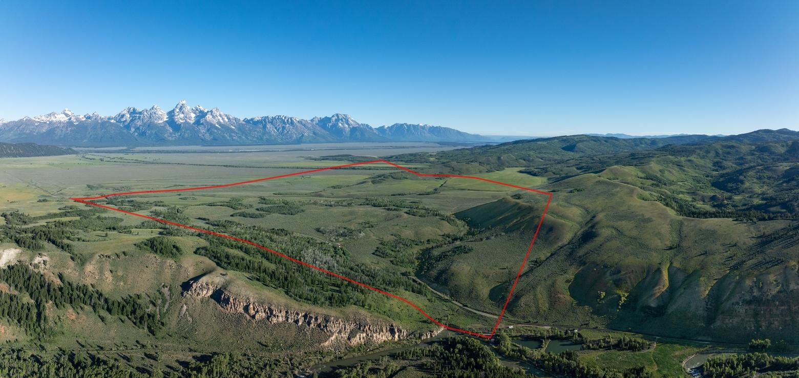 An aerial outline of the 640-acre Kelly Parcel with the Teton Range in the background. Photo courtesy NPS