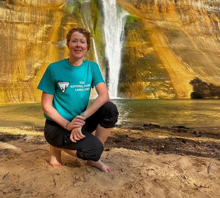 Tracy Stone-Manning served for four years as director of the Bureau of Land Management. Here, she kneels at Grand Staircase-Escalante National Monument in Utah. Public Lands Day weekend, September 2024. Photo 